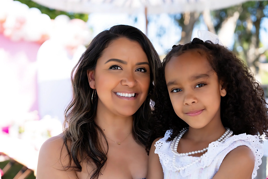 Mother and daughter smiling